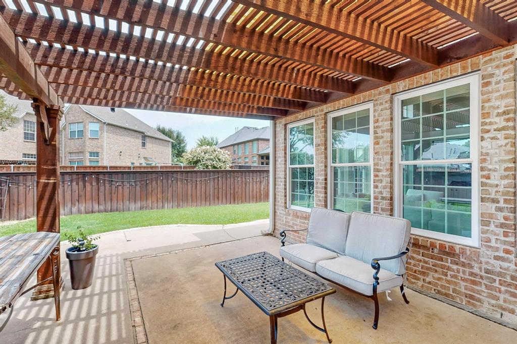 9964 Madrone Drive Frisco, TX 75033 - Photo 32 of 39 a garden view with a seating space
