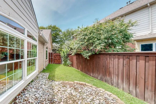 a view of a backyard with pathway