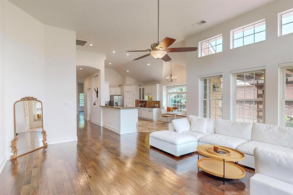 9964 Madrone Drive Frisco, TX 75033 - Photo 6 of 39 a living room with furniture couches and a view of kitchen