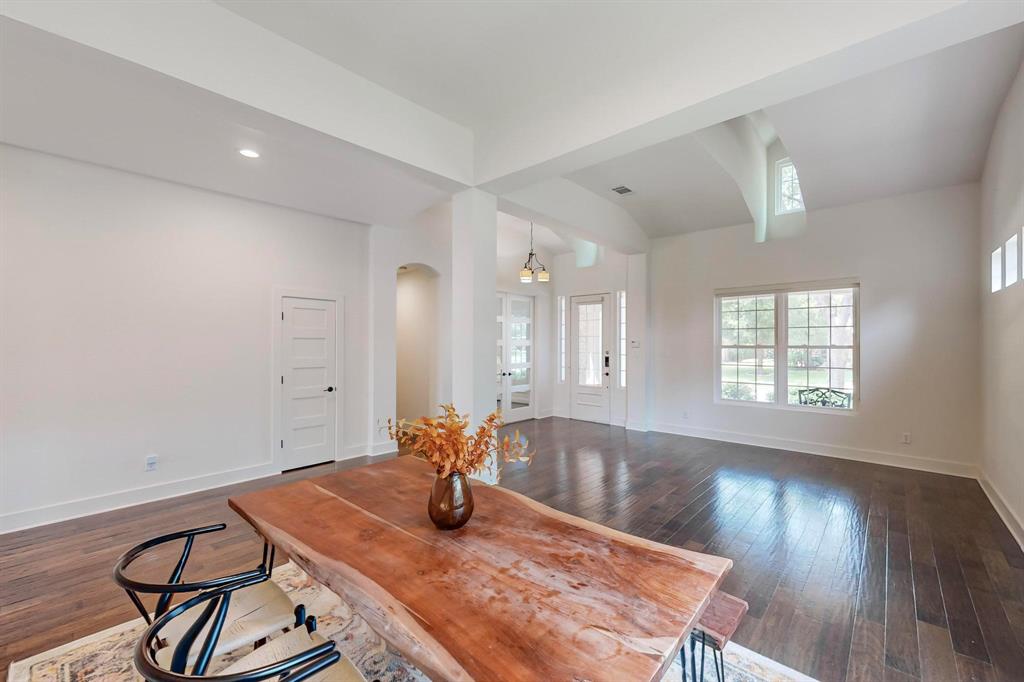 9964 Madrone Drive Frisco, TX 75033 - Photo 10 of 39 a view of a dining room with furniture and wooden floor