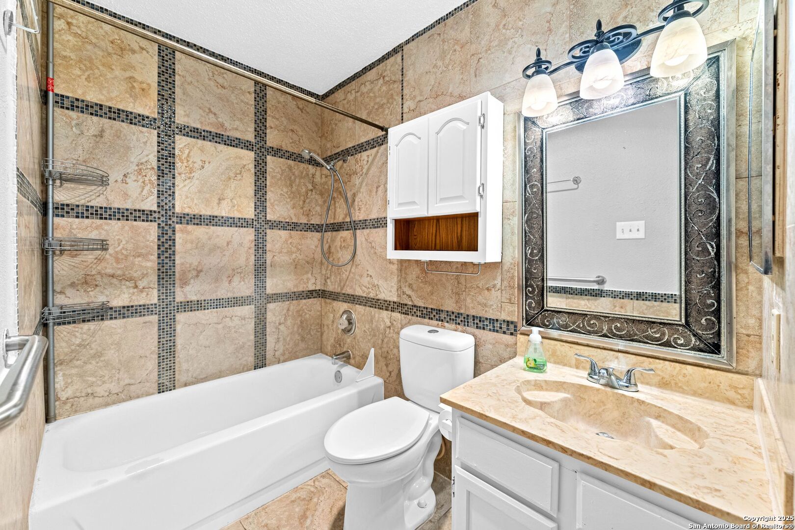 4949 Hamilton Wolfe Road, Unit 8104 San Antonio, TX 78229 - Photo 14 of 27 a bathroom with a sink a toilet and bathtub