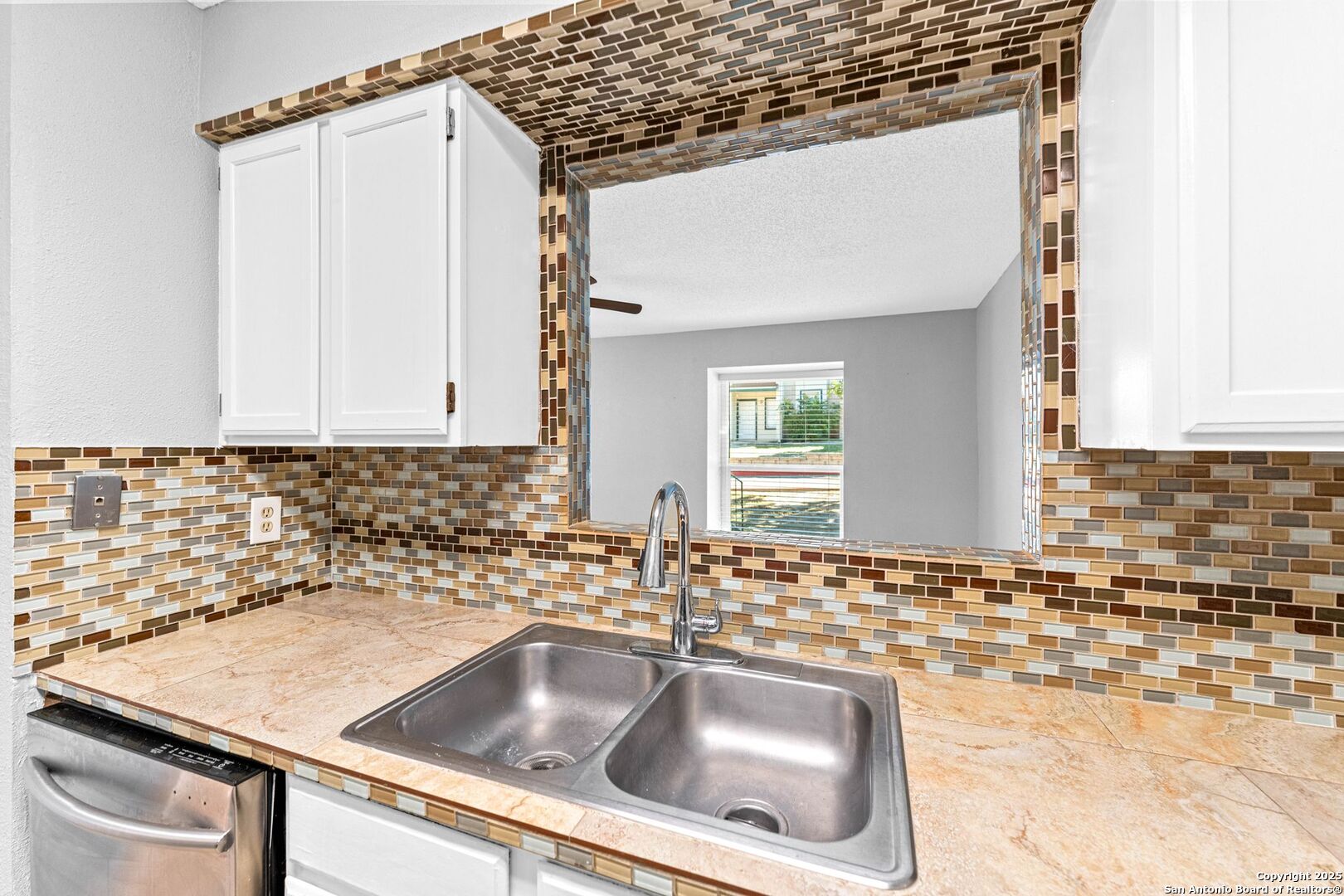 4949 Hamilton Wolfe Road, Unit 8104 San Antonio, TX 78229 - Photo 14 of 27 a kitchen with a sink and cabinets