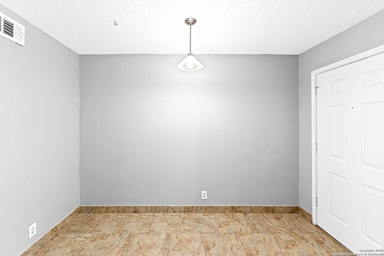 4949 Hamilton Wolfe Road, Unit 8104 San Antonio, TX 78229 - Photo 16 of 27 a view of a room with wooden floor and window