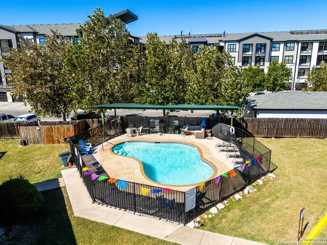 a view of swimming pool with seating space