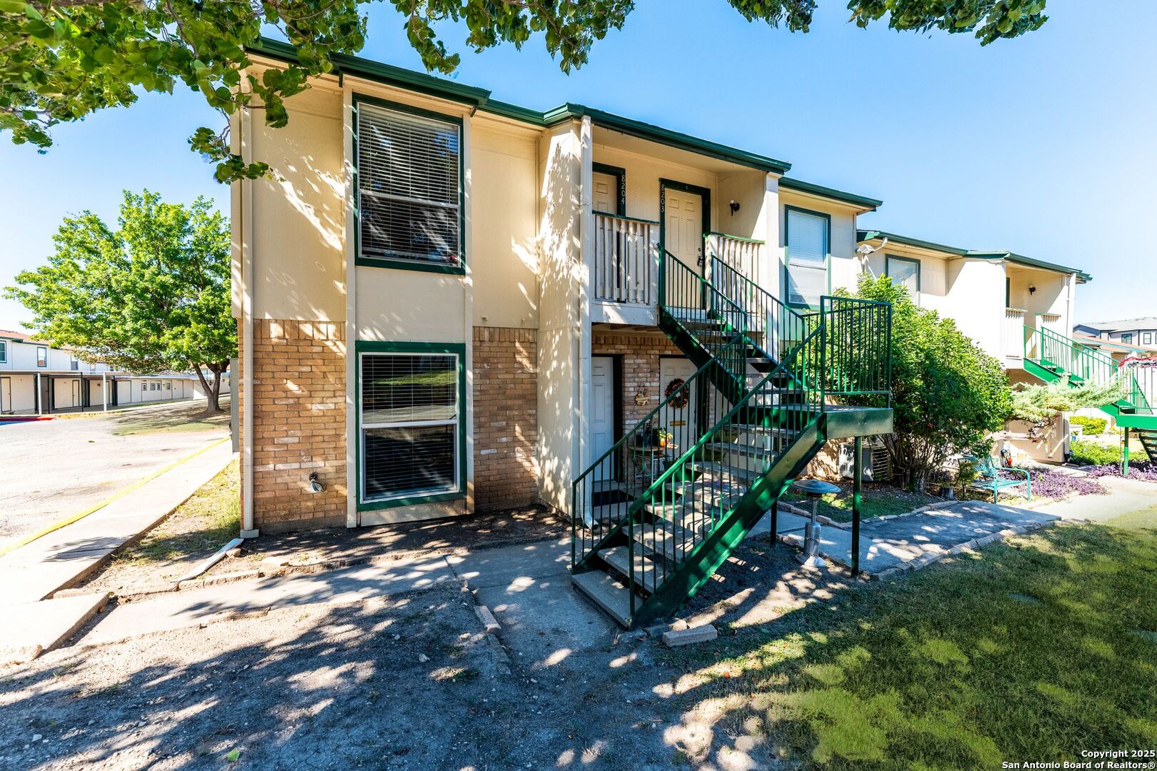 4949 Hamilton Wolfe Road, Unit 8104 San Antonio, TX 78229 - Photo 26 of 27 front view of a house with a yard