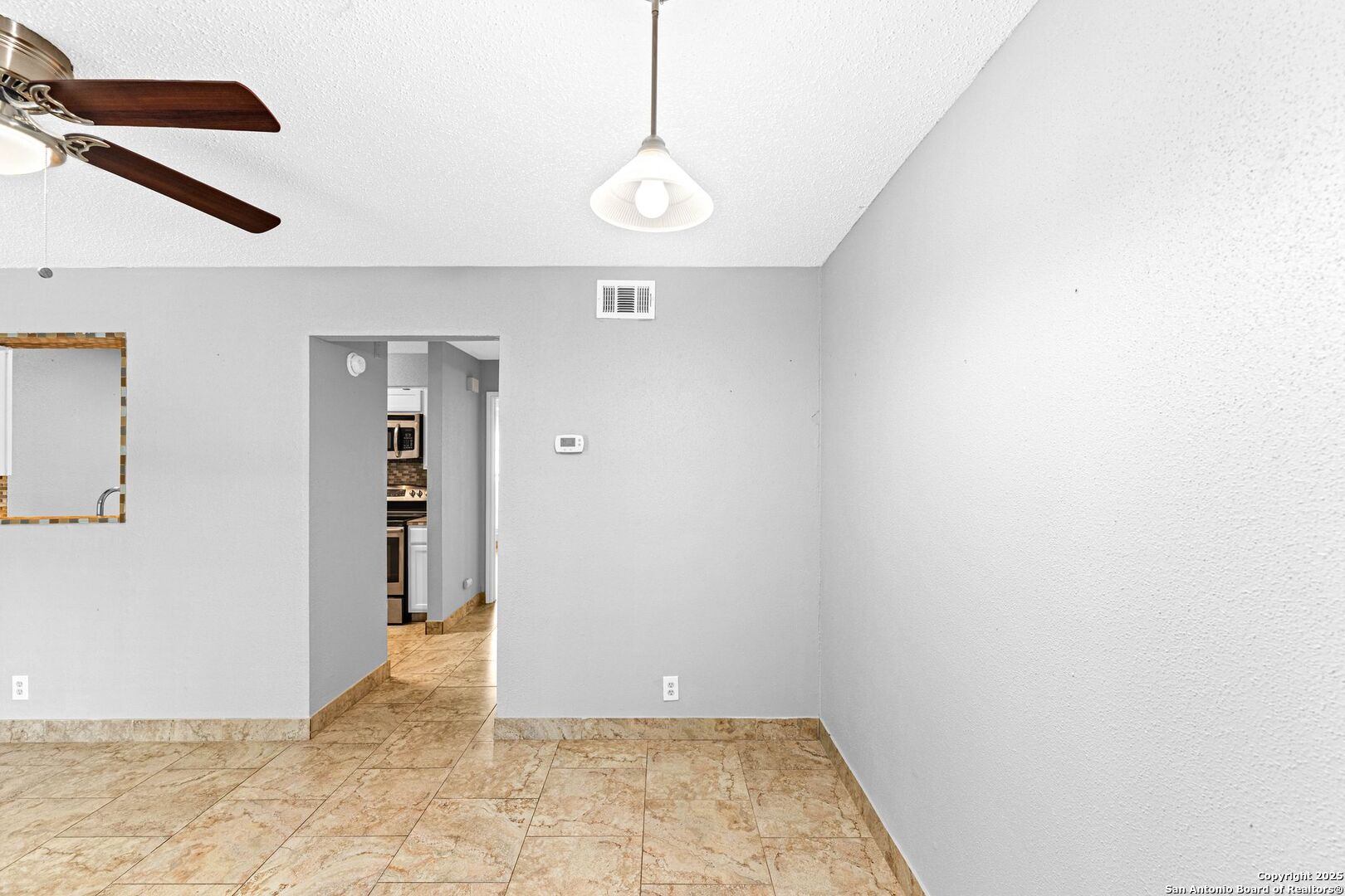 4949 Hamilton Wolfe Road, Unit 8104 San Antonio, TX 78229 - Photo 6 of 27 an empty room with windows