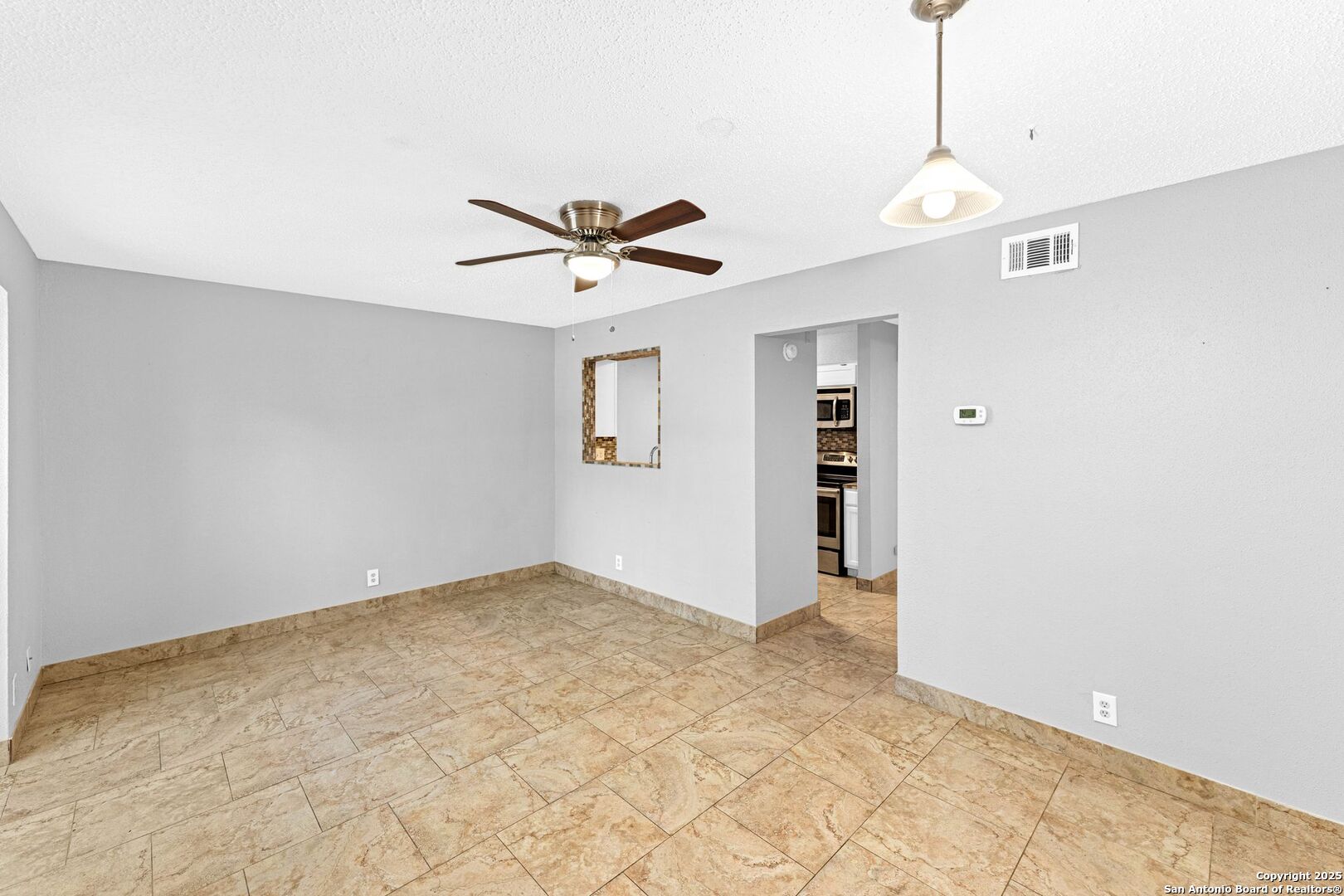 4949 Hamilton Wolfe Road, Unit 8104 San Antonio, TX 78229 - Photo 7 of 27 a view of an empty room with a window