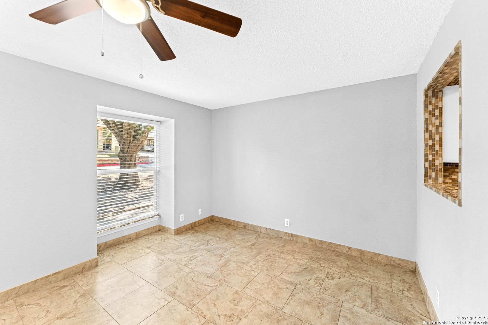 4949 Hamilton Wolfe Road, Unit 8104 San Antonio, TX 78229 - Photo 8 of 27 a view of an empty room with a window