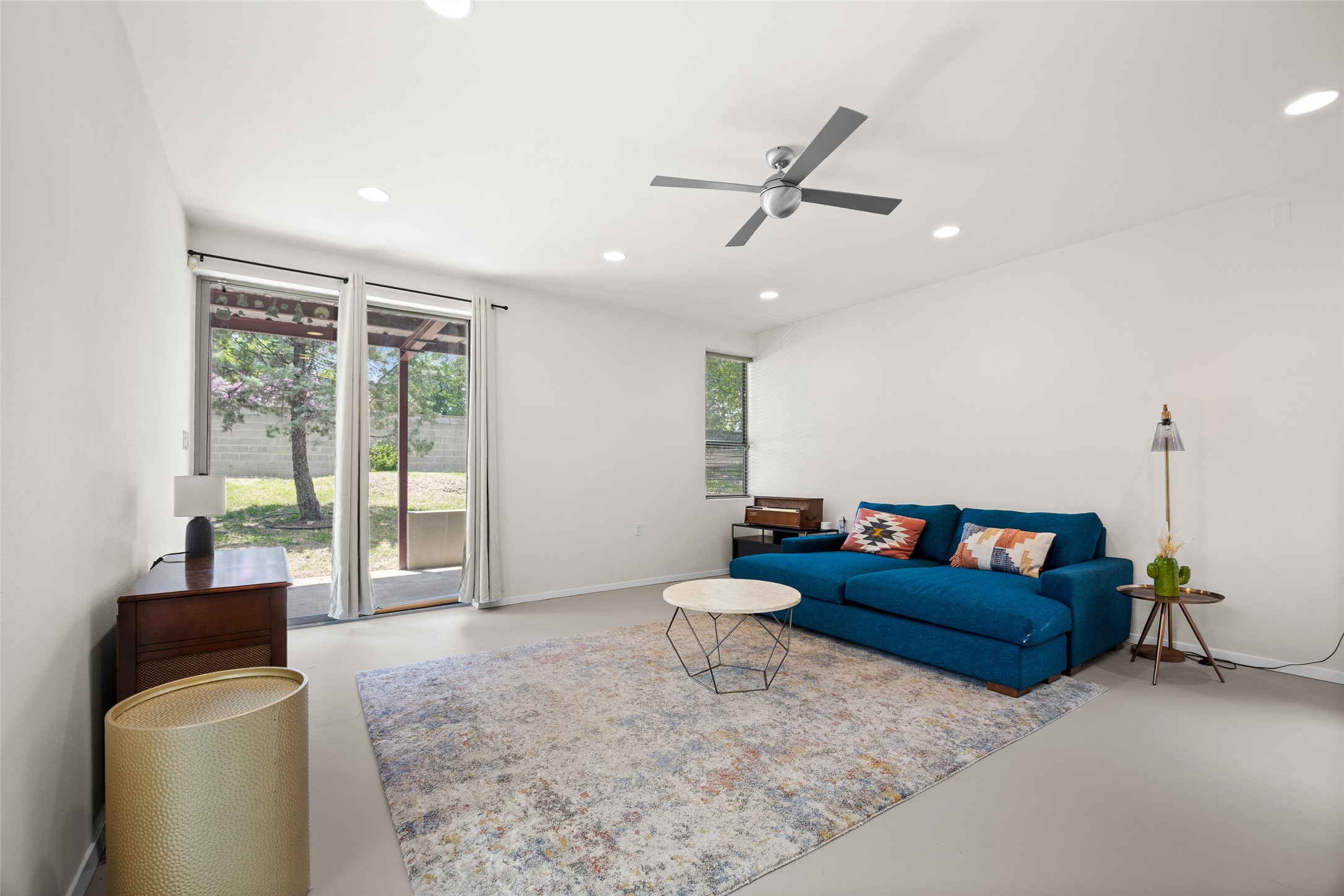 1305 Chestnut Avenue Austin, TX 78702 - Photo 13 of 40 Sliding glass doors offer seamless access to outdoor living from this inviting, well-lit living area.