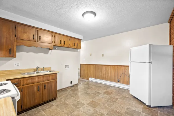 a view of a kitchen with cabinets