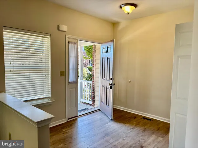 a view of entryway with wooden floor