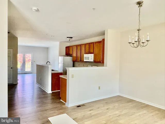 a view of a kitchen and a microwave