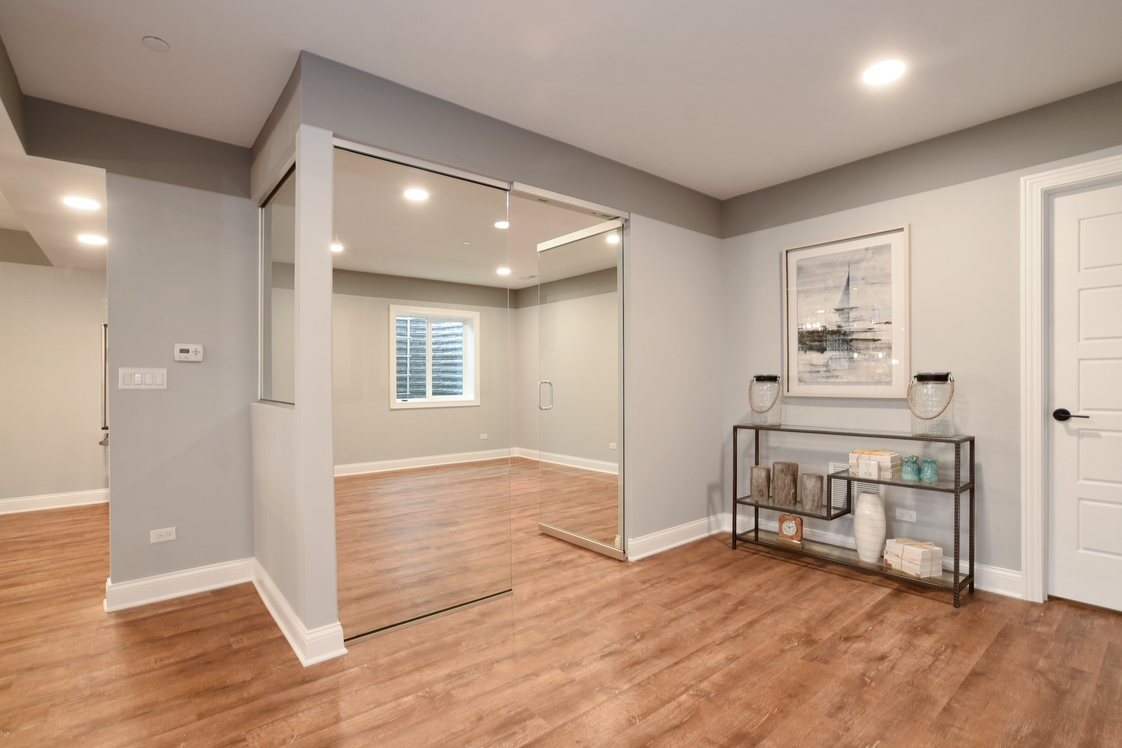 180 Orchard Circle Lake Forest, IL 60045 - Photo 12 of 15 an empty room with wooden floor and windows