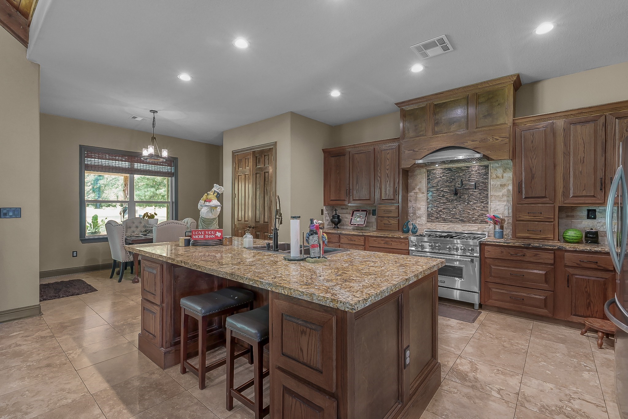 1183 Jones Road New Waverly, TX 77358 - Photo 15 of 40 a kitchen with sink and chairs