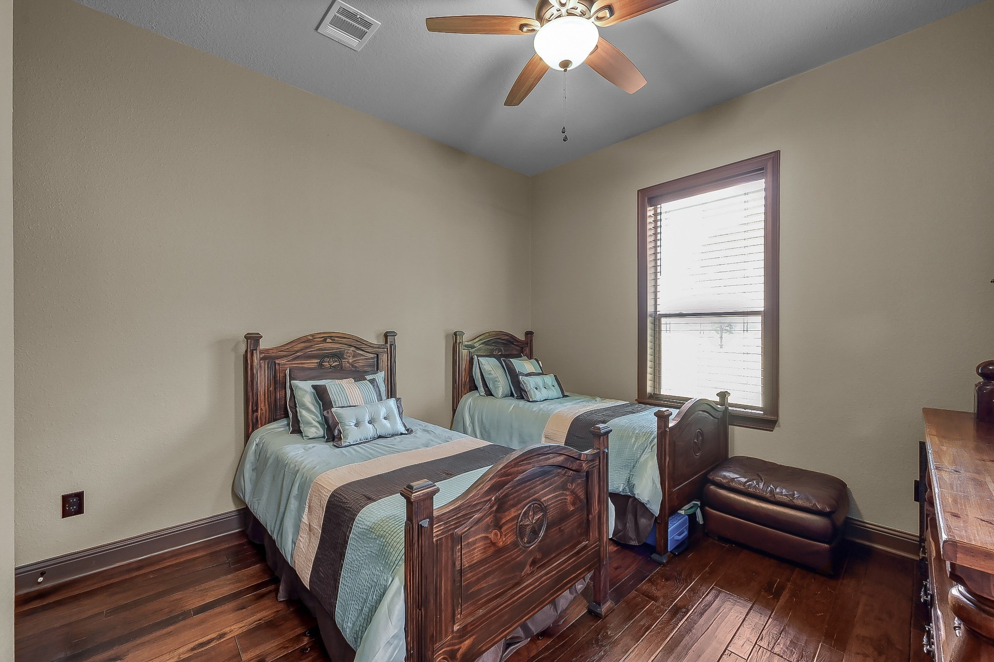 1183 Jones Road New Waverly, TX 77358 - Photo 26 of 40 a bedroom with a bed and a chandelier