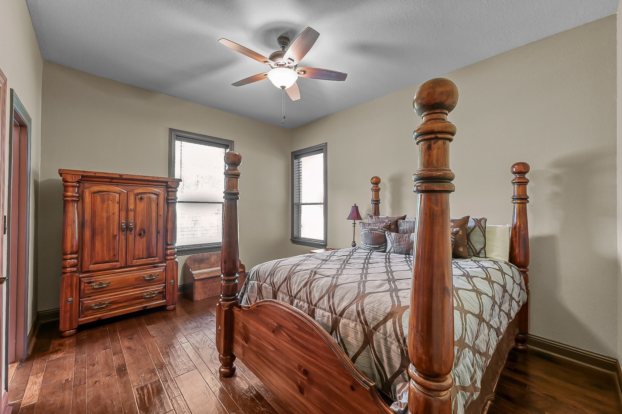 1183 Jones Road New Waverly, TX 77358 - Photo 29 of 40 a bedroom with furniture and wooden floor