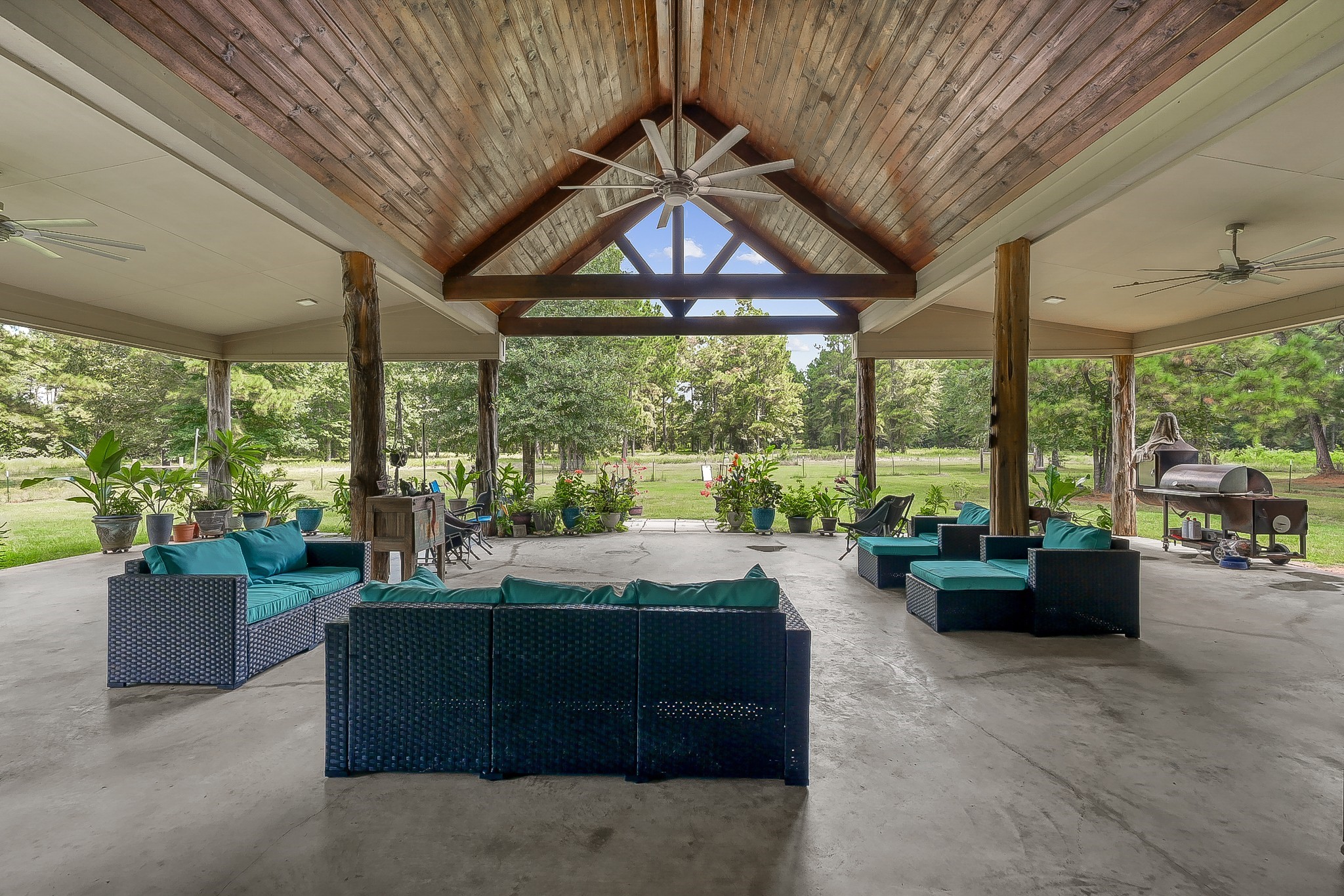 1183 Jones Road New Waverly, TX 77358 - Photo 34 of 40 a living room with furniture and a garden