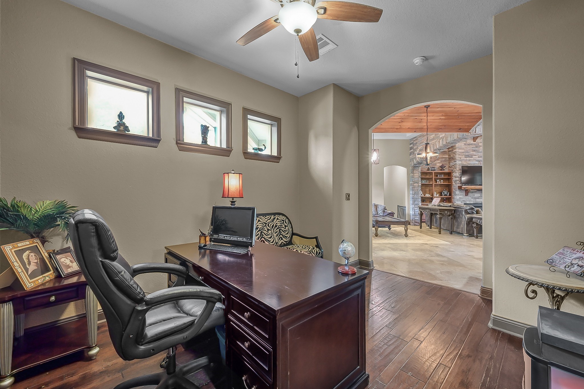 1183 Jones Road New Waverly, TX 77358 - Photo 10 of 40 a view of a workspace with furniture and wooden floor
