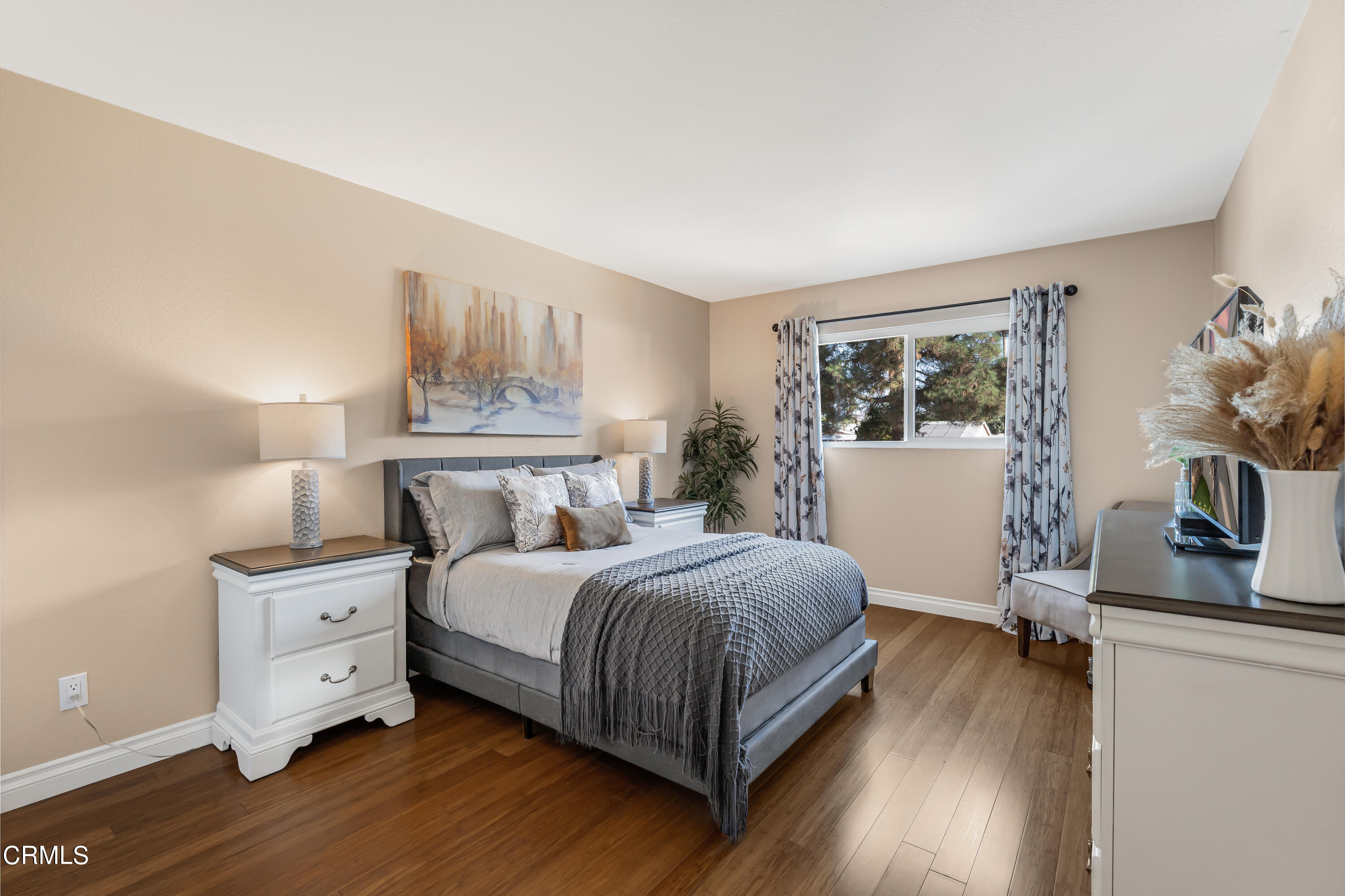 6392 Katherine Road, Unit B Simi Valley, CA 93063 - Photo 11 of 26 a bedroom with a bed and a flat tv screen on the dresser