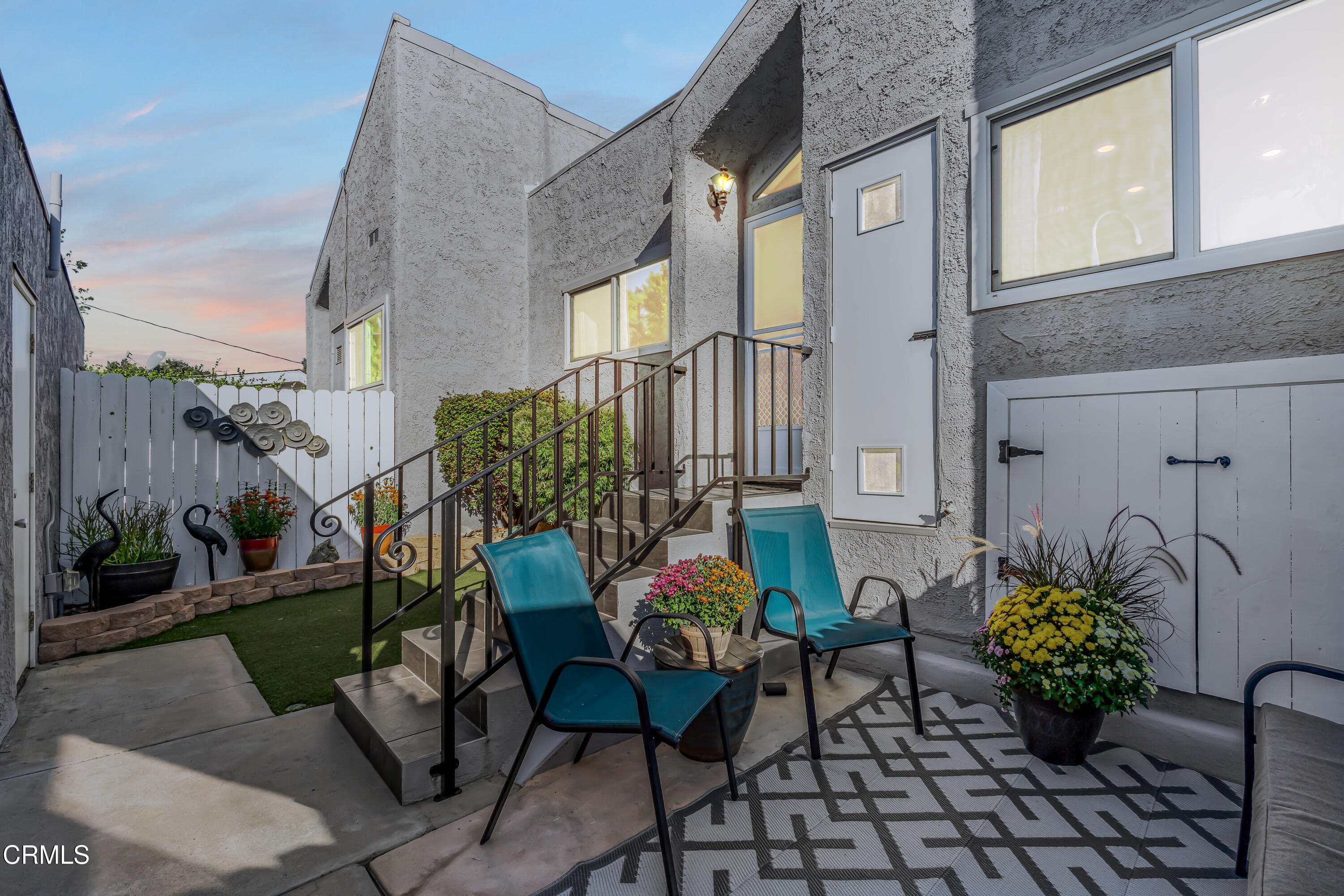 6392 Katherine Road, Unit B Simi Valley, CA 93063 - Photo 17 of 26 a backyard of a house with table and chairs