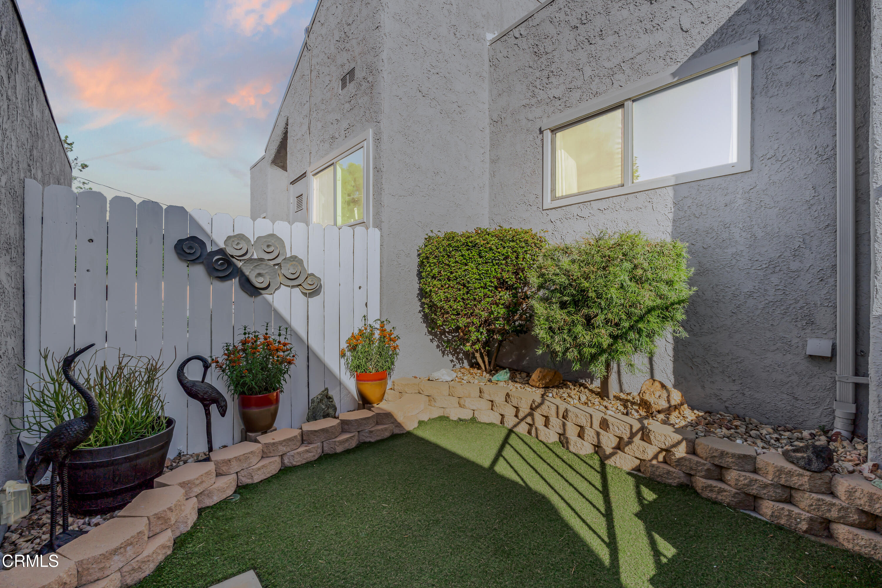 6392 Katherine Road, Unit B Simi Valley, CA 93063 - Photo 19 of 26 a front view of a house with garden