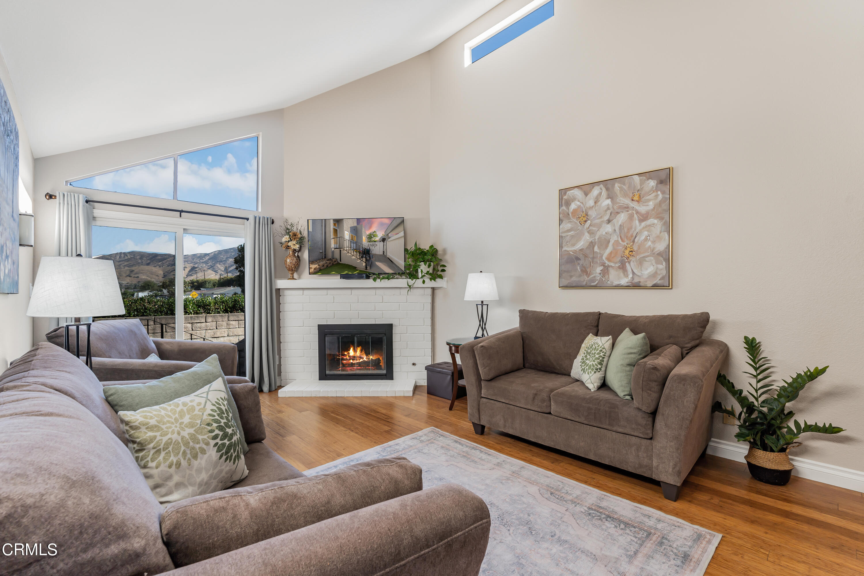 6392 Katherine Road, Unit B Simi Valley, CA 93063 - Photo 2 of 26 a living room with furniture and a fireplace