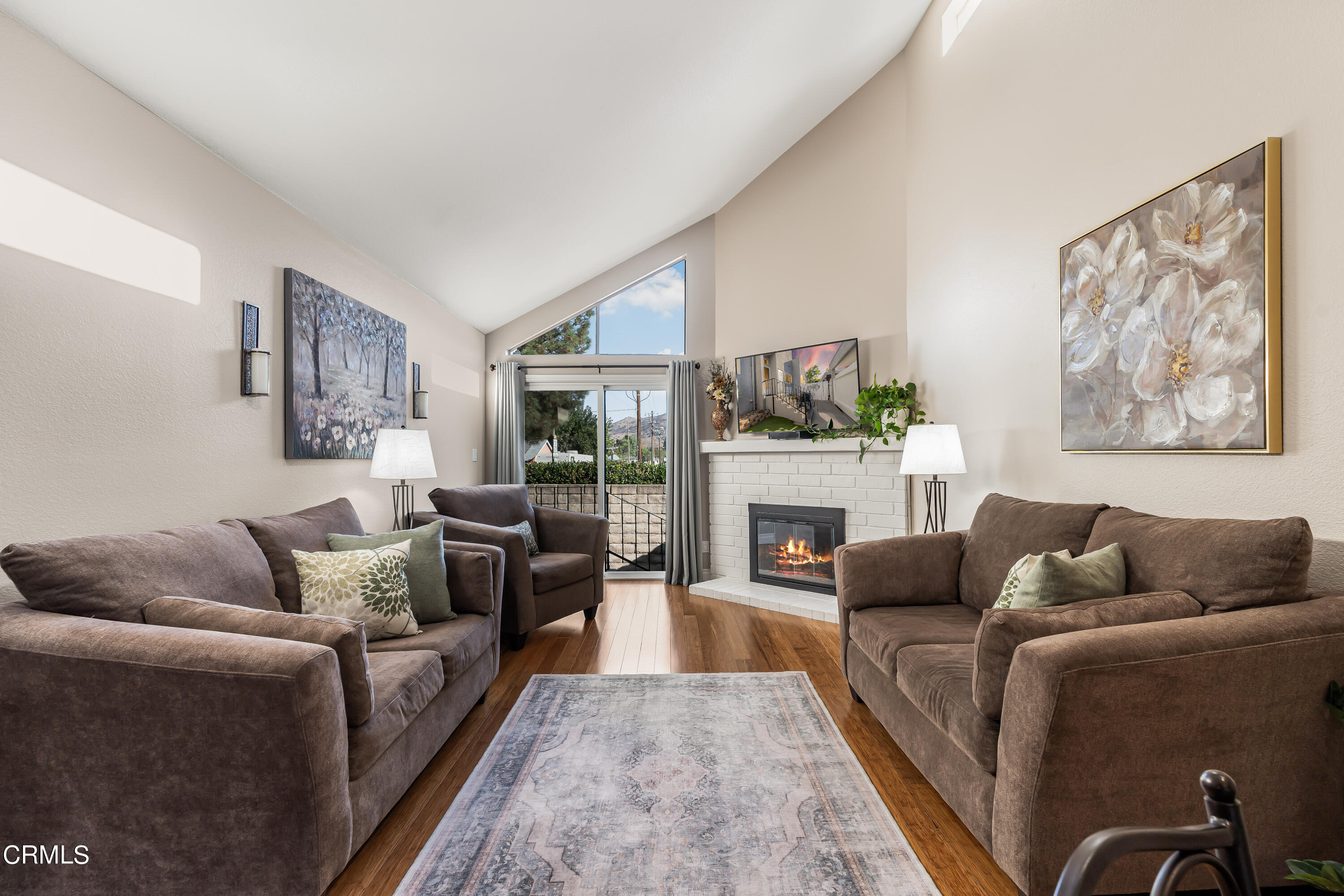 6392 Katherine Road, Unit B Simi Valley, CA 93063 - Photo 3 of 26 a living room with furniture and a fireplace