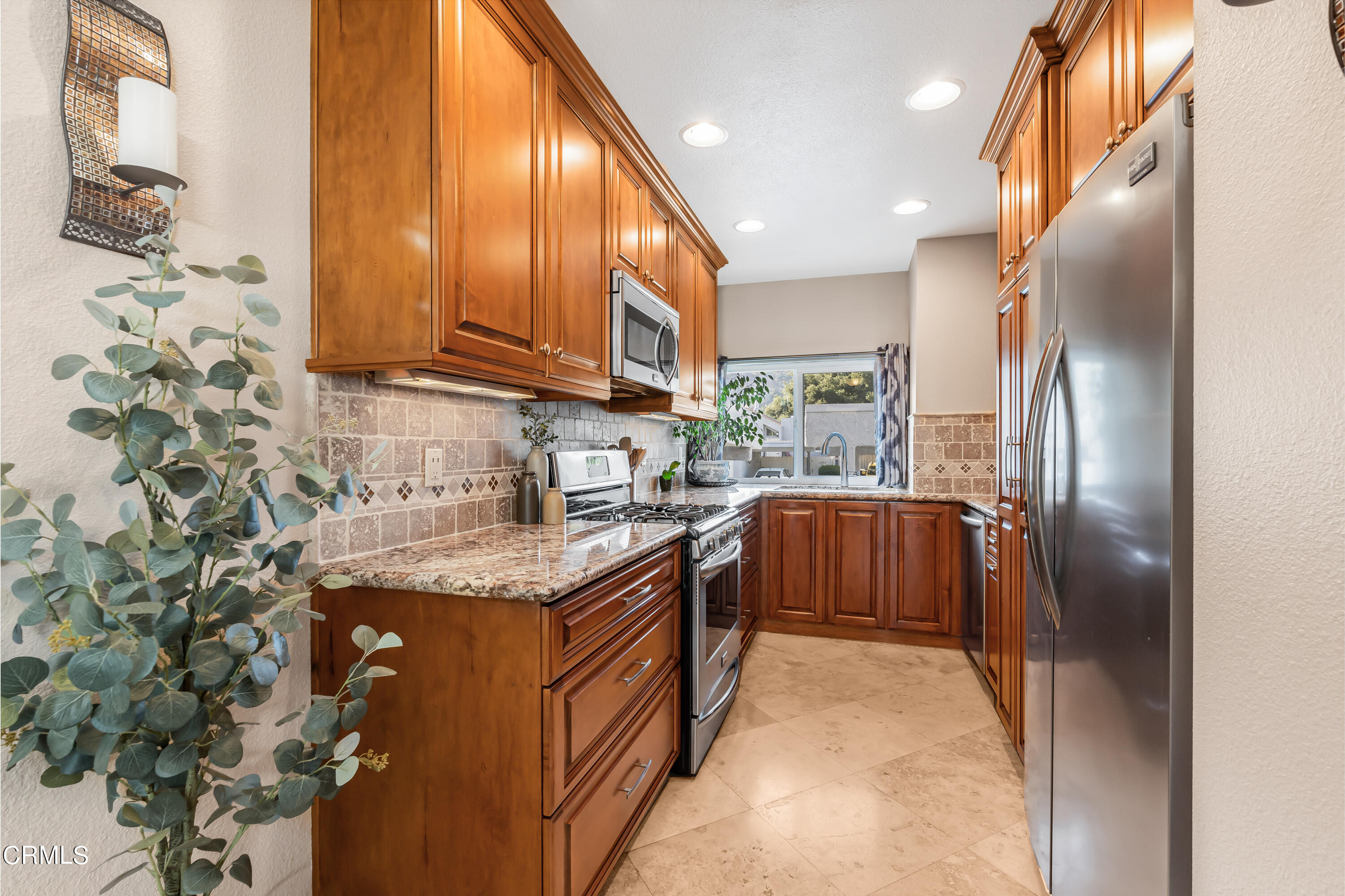 6392 Katherine Road, Unit B Simi Valley, CA 93063 - Photo 7 of 26 a kitchen with stainless steel appliances granite countertop a refrigerator and a sink