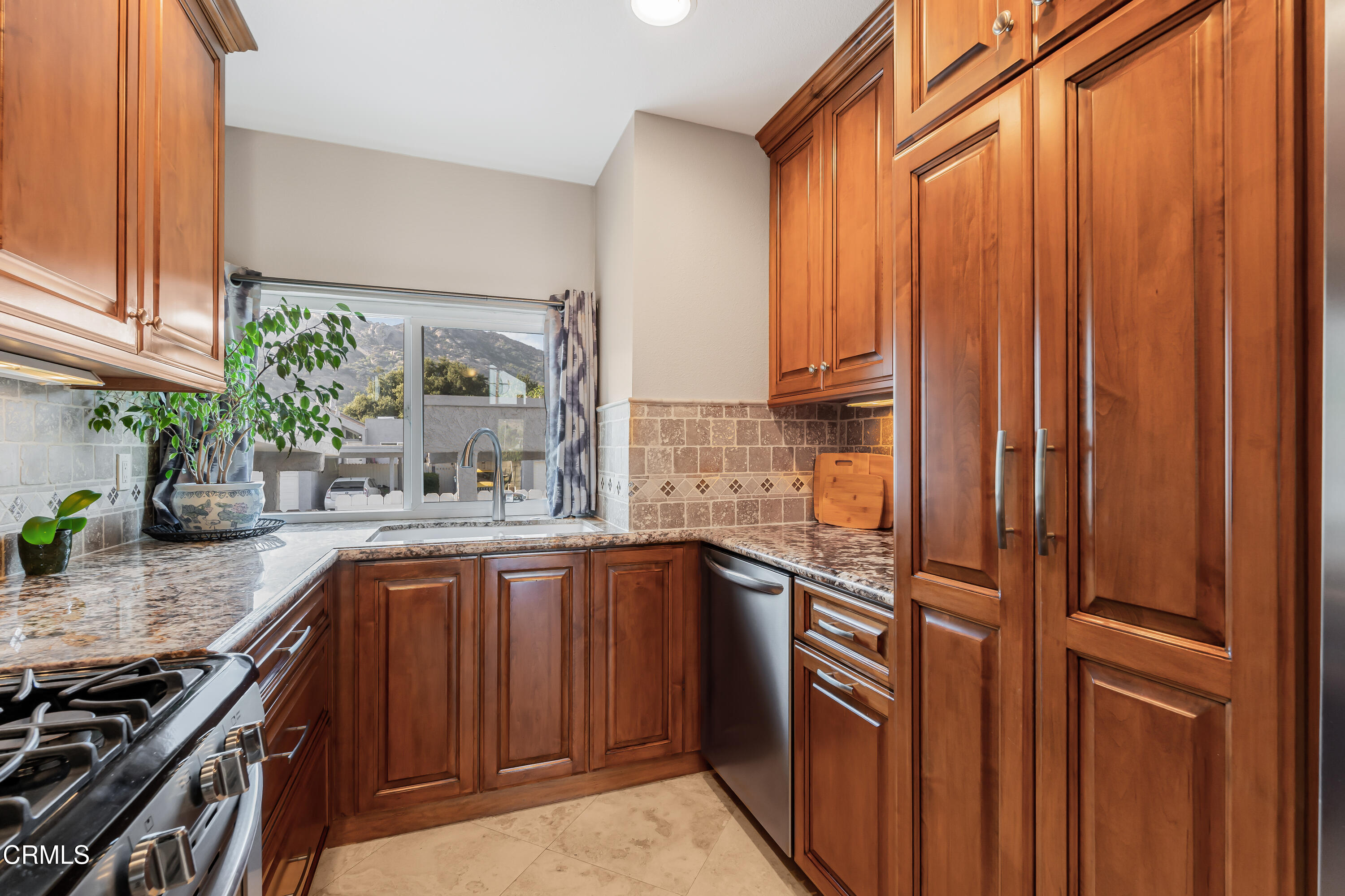 6392 Katherine Road, Unit B Simi Valley, CA 93063 - Photo 8 of 26 a kitchen with stainless steel appliances granite countertop a refrigerator and a sink