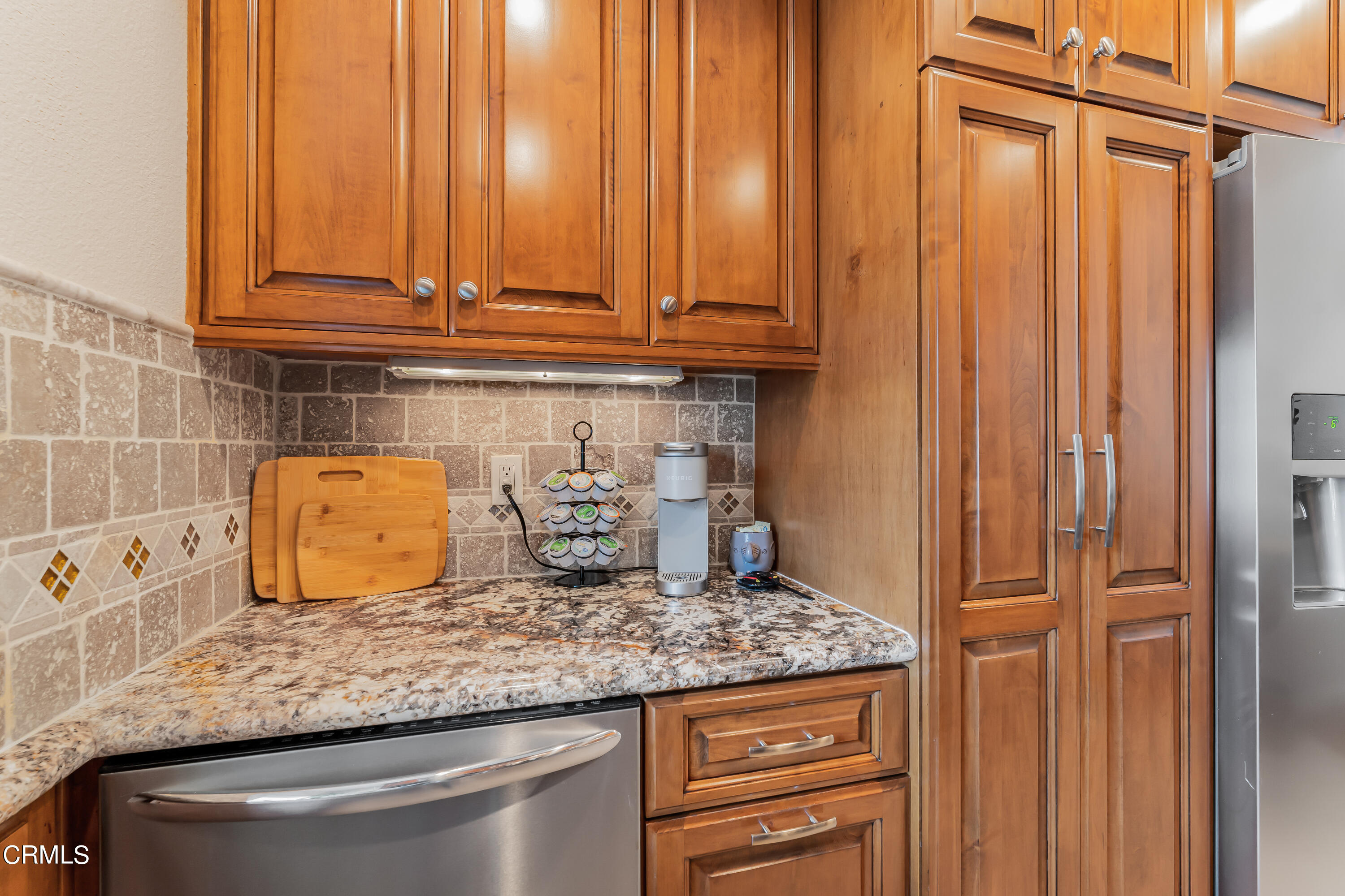 6392 Katherine Road, Unit B Simi Valley, CA 93063 - Photo 10 of 26 a kitchen with granite countertop a sink and cabinets