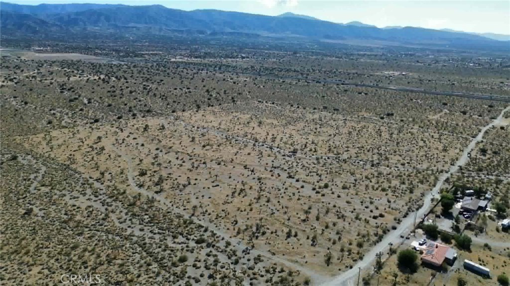 2525 Goss Road Pinon Hills, CA 92372 - Photo 4 of 6 a view of a dry yard and mountain