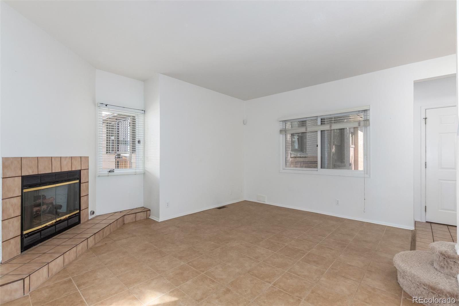 515 Cook Street Denver, CO 80206 - Photo 14 of 40 a view of empty room with a fireplace