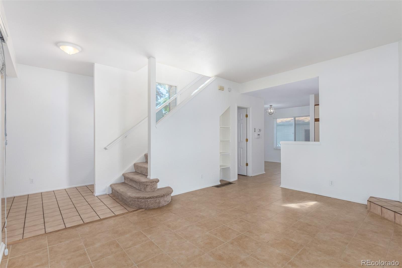 515 Cook Street Denver, CO 80206 - Photo 15 of 40 a view of an empty room with stairs