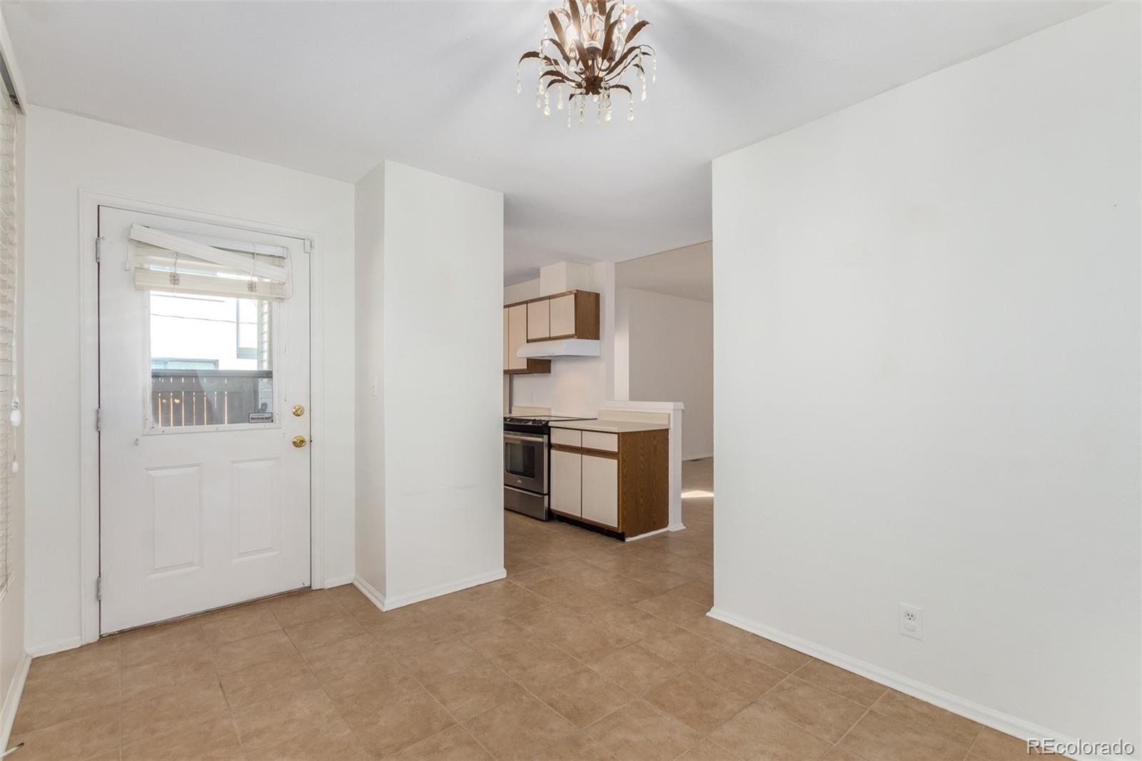 515 Cook Street Denver, CO 80206 - Photo 18 of 40 a view of a kitchen with a sink cabinets and a window