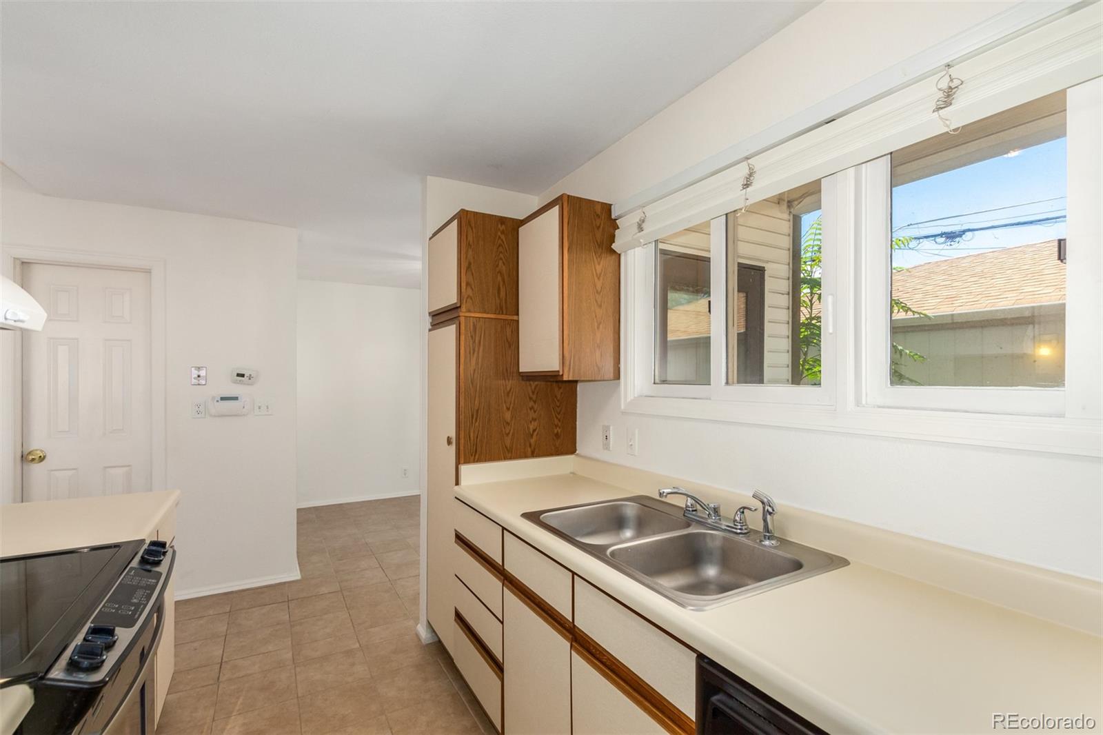 515 Cook Street Denver, CO 80206 - Photo 21 of 40 a bathroom with a sink and a window