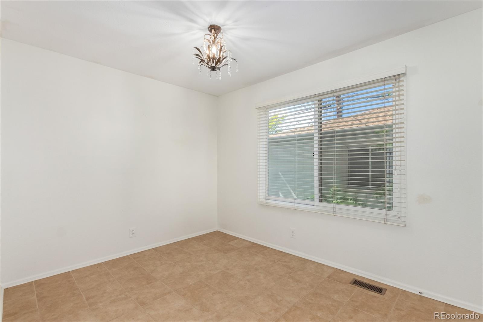 515 Cook Street Denver, CO 80206 - Photo 29 of 40 a view of an empty room with a window