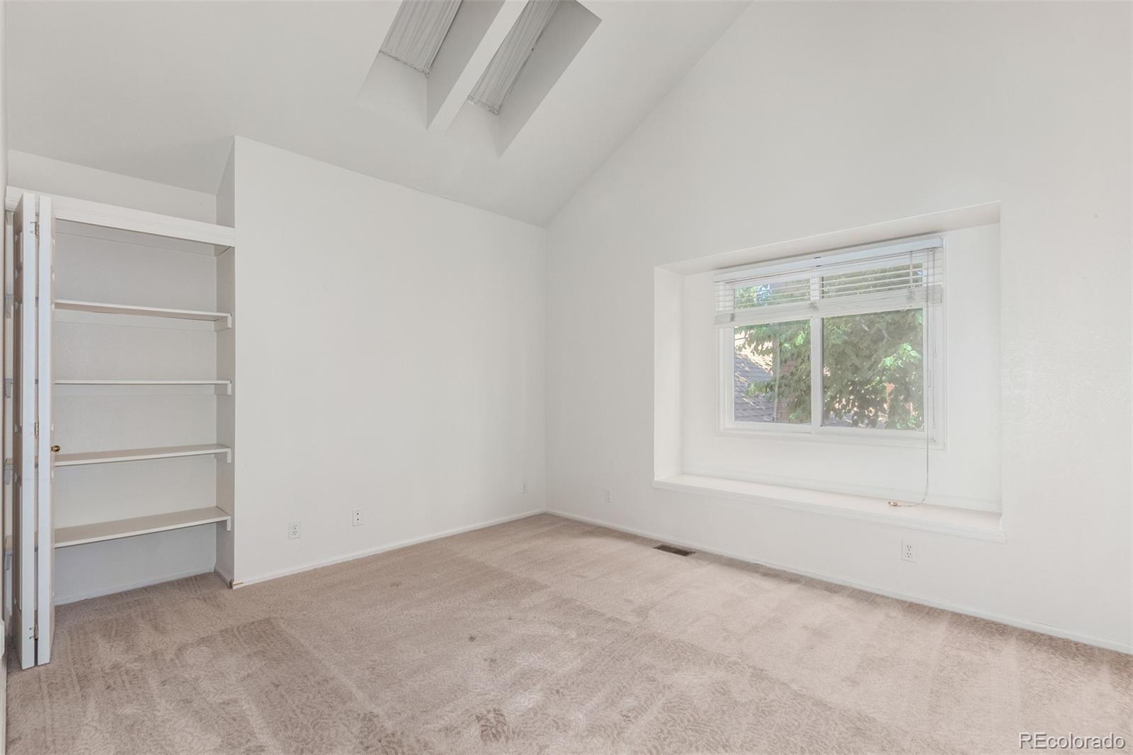 515 Cook Street Denver, CO 80206 - Photo 31 of 40 a view of an empty room with a window