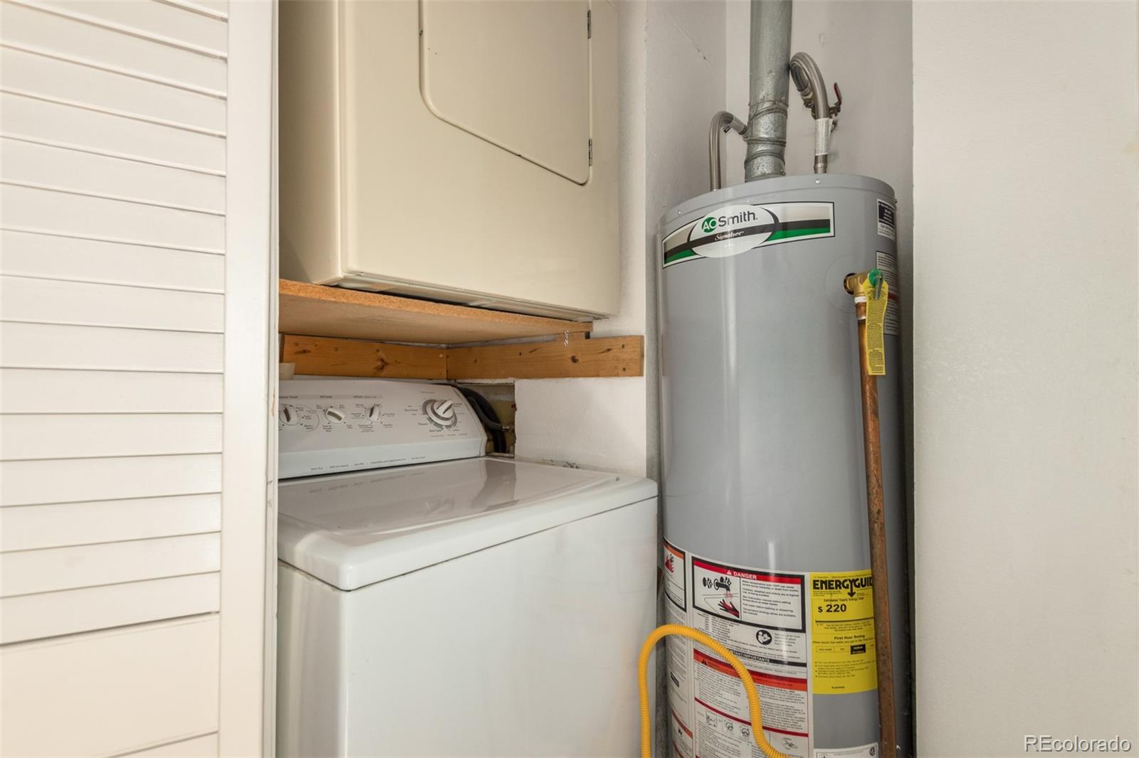 515 Cook Street Denver, CO 80206 - Photo 34 of 40 a utility room with dryer and washer