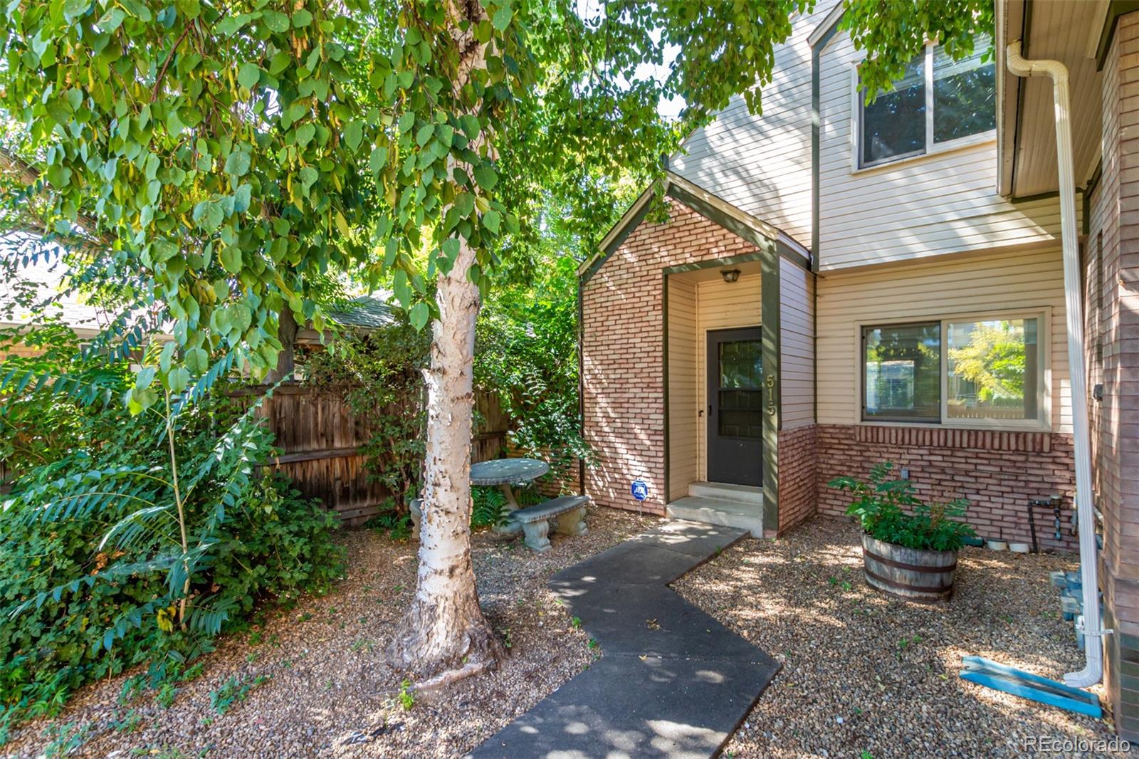 515 Cook Street Denver, CO 80206 - Photo 7 of 40 a front view of a house with garden