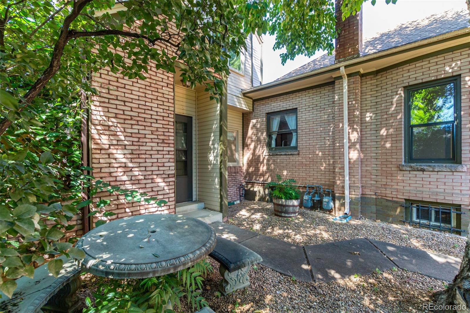 515 Cook Street Denver, CO 80206 - Photo 8 of 40 a view of a house with a backyard