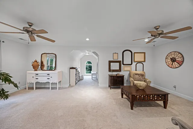 a bedroom with furniture and a mirror