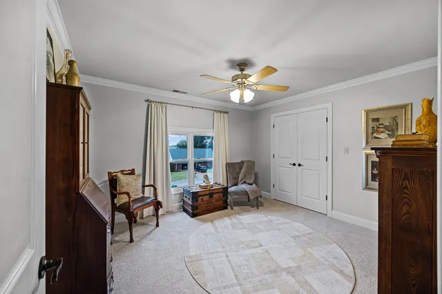a view of a livingroom with furniture and a window