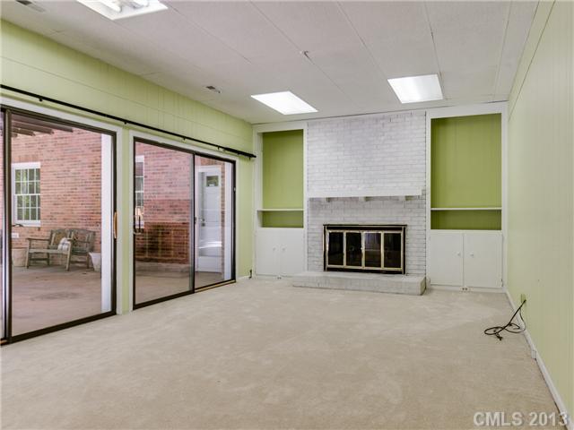 2717 High Ridge Road Charlotte, NC 28270 - Photo 14 of 16 a view of an empty room with a fireplace and a window
