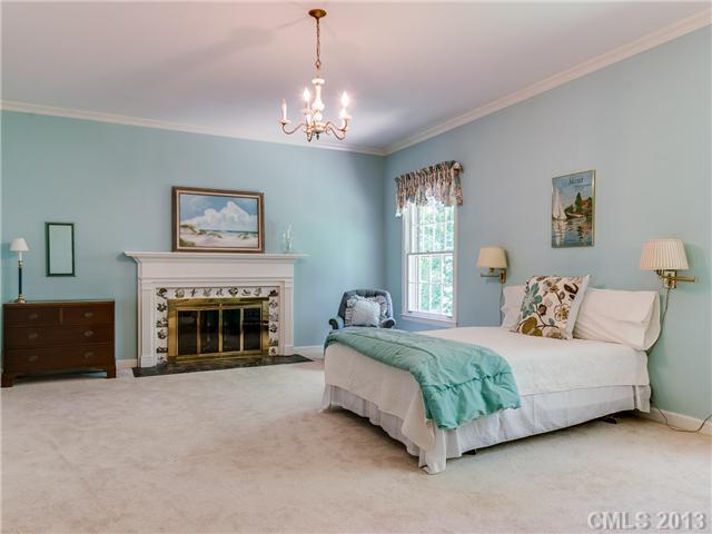 2717 High Ridge Road Charlotte, NC 28270 - Photo 8 of 16 a spacious bedroom with a bed and a fireplace