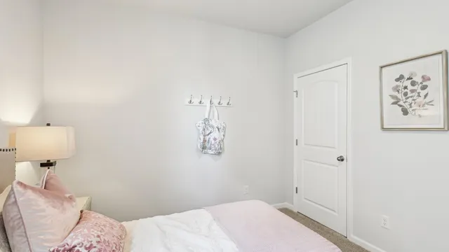 a bedroom with a bed and a table