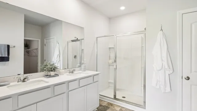 a bathroom with a double vanity sink mirror and double