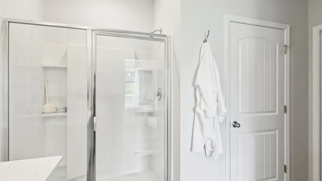 a bathroom with a shower and a curtain