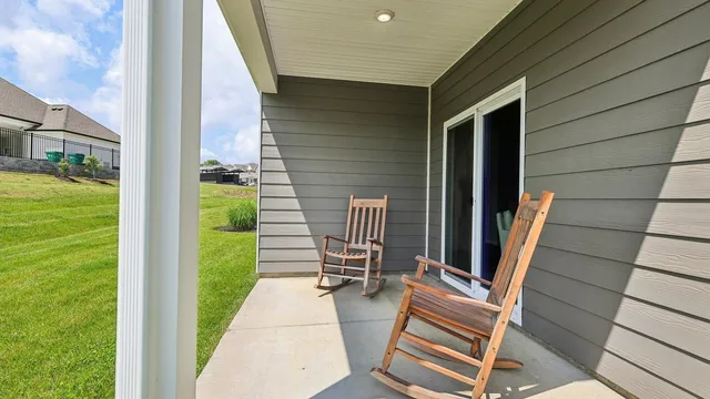 a backyard of a house with outdoor seating