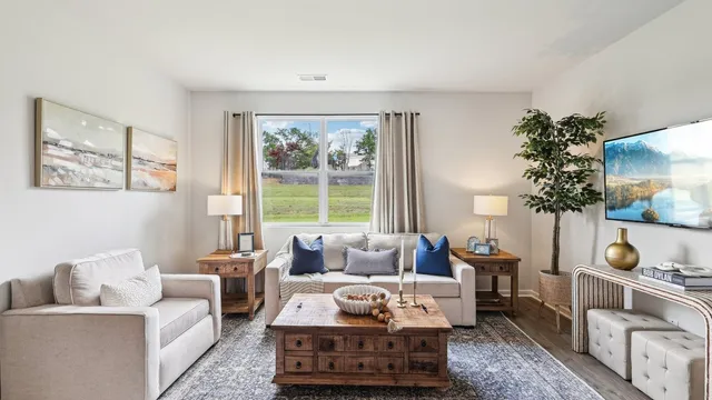 a living room with furniture and a window