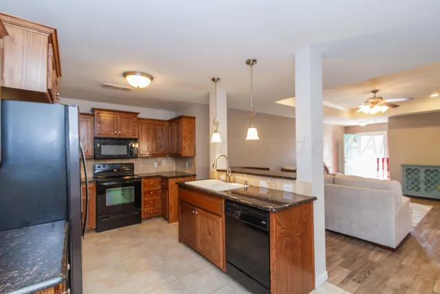 a view of a dining room with furniture wooden floor and chandelier